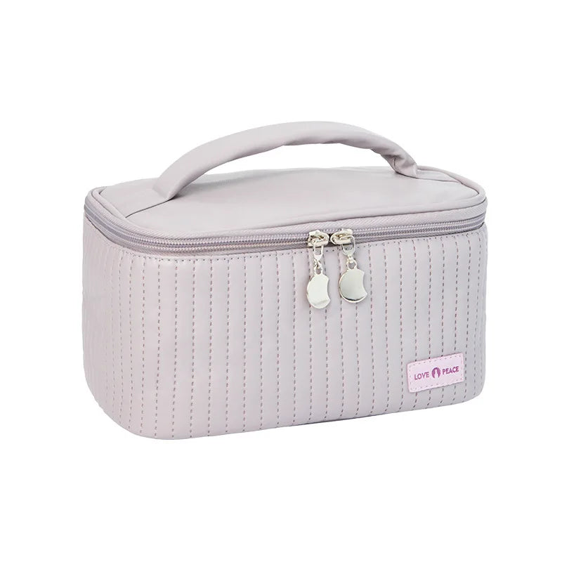 grande trousse de toilette matelassée coloris violet clair