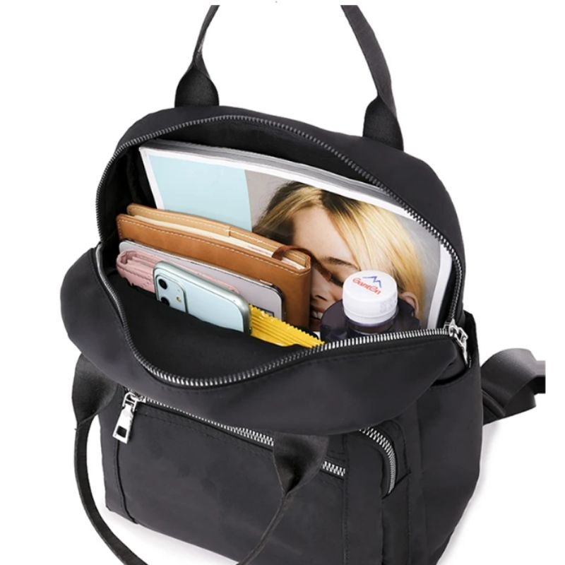 sac à dos urbain femme vue d'intérieur remplie