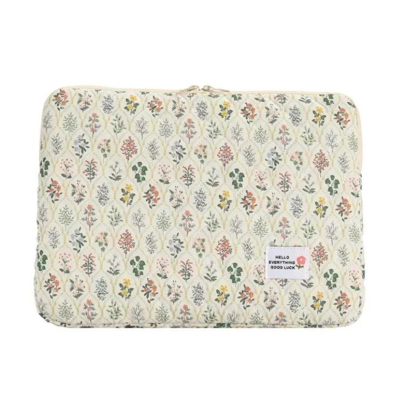 pochette d'ordinateur fleurie et matelassée blanche vue de face