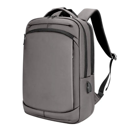 sac à dos pour ordinateur en voyage d'affaires couleur gris vue de profil